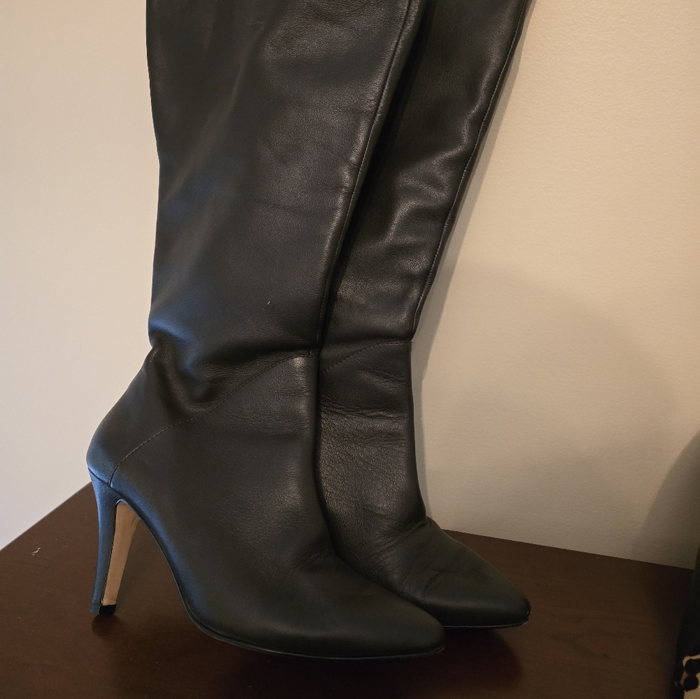 Dark brown leather boots, gently used.  Wide calf